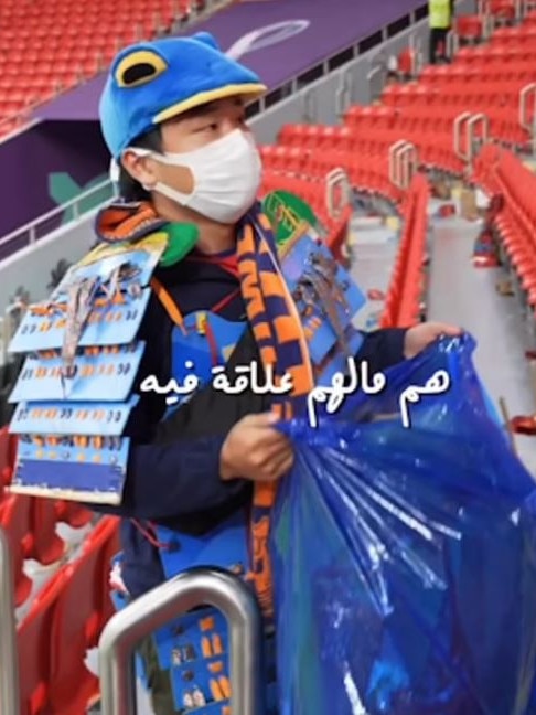 images of Japan fans cleaning up