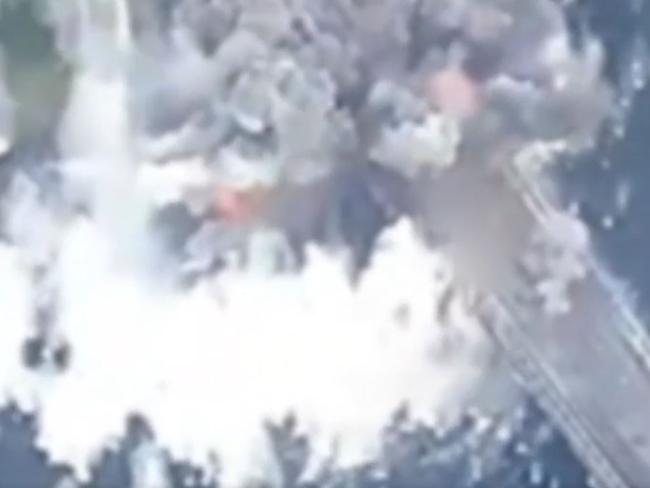 Aerial footage posted by Air Force Commander Mykola Oleschuk shows a large explosion causing a section of bridge to collapse. Picture: Ukrainian Air Force via Storyful