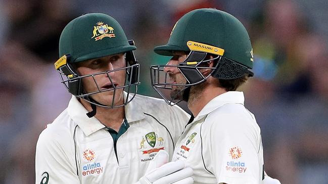 Marnus Labuschagne (left) and Joe Burns shared an 87-run partnership on day three.