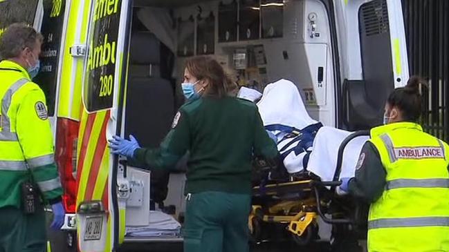 Police and ambulance officers at Windsor Gardens, after a student was assaulted at Avenues College. Picture: 7NEWS