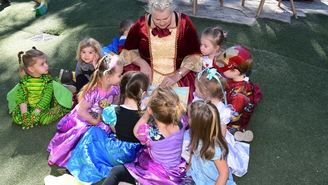 Acorn Bundaberg East senior educator Rebecca Bell with (clockwise) Hannah, August, Hadley, Delilah, Stella, Mila, Ellah, Kobi, Indie and Lachlan.