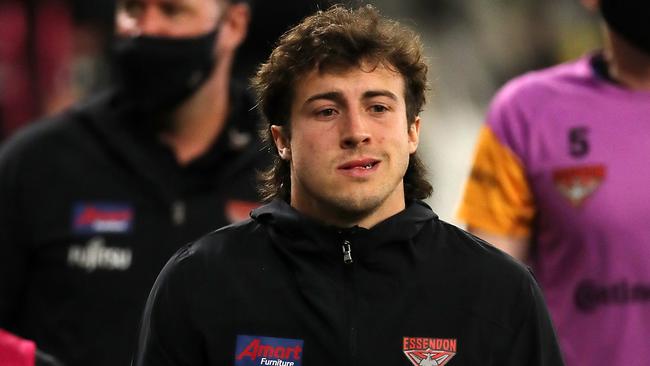 PERTH, AUSTRALIA - JUNE 05: Andrew McGrath of the Bombers leaves the field at the main break during the 2021 AFL Round 12 match between the Essendon Bombers and the Richmond Tigers at Optus Stadium on June 5, 2021 in Perth, Australia. (Photo by Will Russell/AFL Photos via Getty Images)