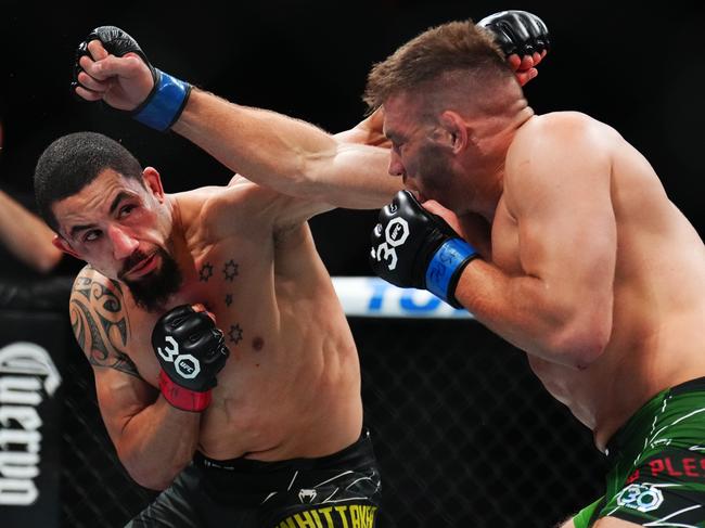 LAS VEGAS, NEVADA - JULY 08: (L-R) Robert Whittaker of New Zealand trades punches with Dricus Du Plessis of South Africa in a middleweight fight during the UFC 290 event at T-Mobile Arena on July 08, 2023 in Las Vegas, Nevada. (Photo by Chris Unger/Zuffa LLC via Getty Images)