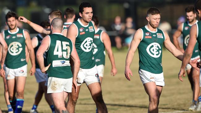 Greensborough players gather at three-quarter-time. Picture: Steve Tanner