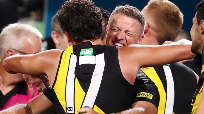 Hardwick hugs Daniel Rioli after winning last year’s Grand Final. Picture: Sarah Reed