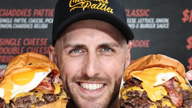 Owner Taran Lee, from Runaway Bay restaurant Chaddies Patties, with some of the Burgers that won the best burger on the Gold Coast. Picture Glenn hampson