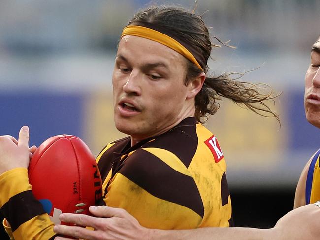 PERTH, AUSTRALIA - JUNE 30: Jack Ginnivan of the Hawks marks the ball under pressure from Brady Hough of the Eagles during the 2024 AFL Round 16 match between the West Coast Eagles and the Hawthorn Hawks at Optus Stadium on June 30, 2024 in Perth, Australia. (Photo by Will Russell/AFL Photos via Getty Images)