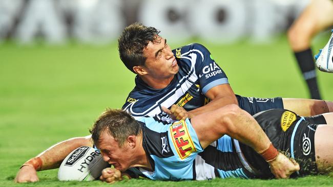 Round 3 match of the NRL Telstra Premiership between the North Queensland Cowboys v Cronulla Sharks from 1300 Smiles Stadium, Towsnville. Sharks Josh Morris scores a try while Cowboys Te Maire Martin attempts to tackle. Picture: Zak Simmonds