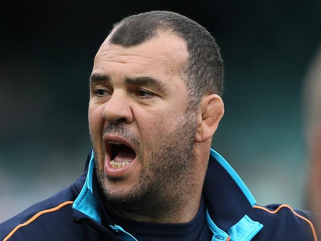 SYDNEY, AUSTRALIA - MAY 18: Waratahs coach Michael Cheika talks to players as they warm up during the round 14 Super Rugby match between the Waratahs and the Lions at Allianz Stadium on May 18, 2014 in Sydney, Australia. (Photo by Cameron Spencer/Getty Images)