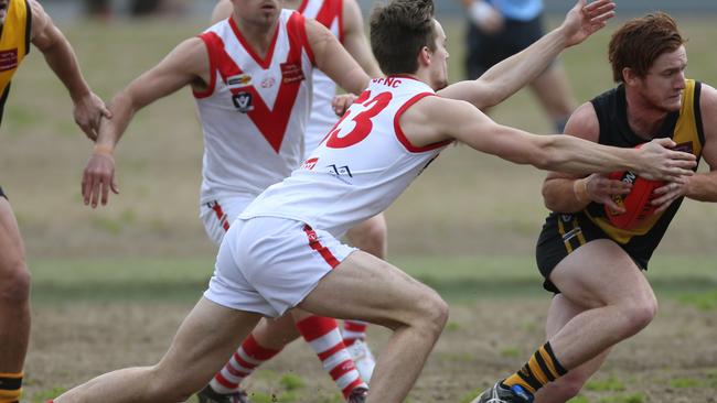 Olinda Ferny Creek’s Lachlan Meadows tackles Woori Yallock's Hayden Smith. Picture: Brendan Francis