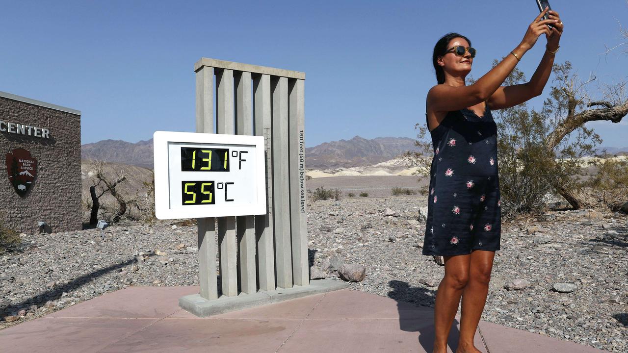 A visitor takes a photo in front of an unofficial thermometer at Furnace Creek Visitor Center on August 17, 2020 in Death Valley National Park, California, US. Picture: Getty Images/AFP
