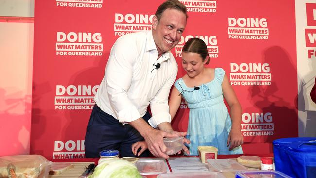 Premier Steven Miles holds his party launch at the North Lakes Community Centre. Premier Miles makes a sandwich with his daughter Bridie 10 on stage. Pics Adam Head