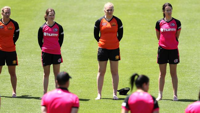 Perth Scorchers and Sydney Sixers players form a barefoot circle before a WBBL match in Sydney last year Picture: Getty Images