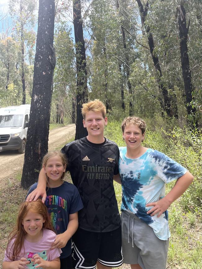 Coby, 14, Ori, 13, Sivan, 11, and Tali Refael, 6, spotted a giant lace monitor up a tree in Mallacoota. Picture: Nicole Refael, Diamond Creek.
