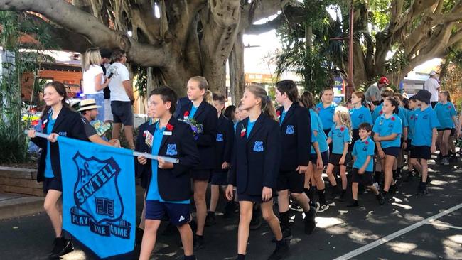 Schoolchildren marching in the Anzac Day parade down the main street of Sawtell.