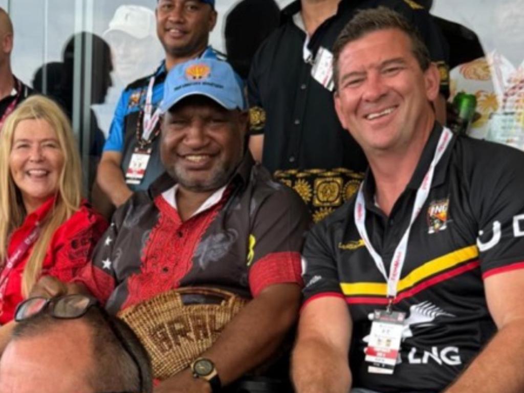 Jason Demetriou pictured alongside PNG Prime Minister James Marape.