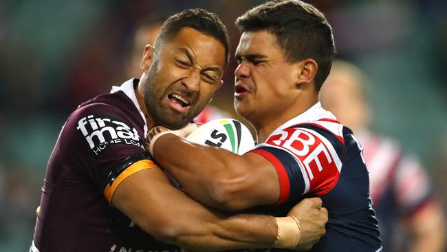 Roosters’ Latrell Mitchell is met by Broncos’ Benji Marshall.