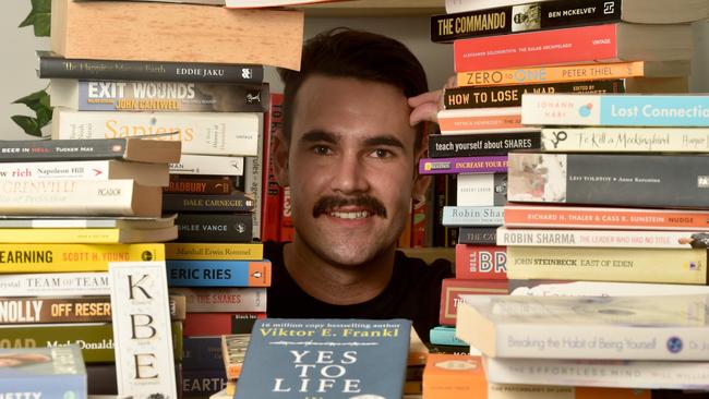 Dylan Conway with some of his many books at his Burdell home. Picture: Evan MorganCaptain Dylan Conway launched Brothers N Books to promote reading as a way of healing from trauma, pain. Picture: Evan Morgan