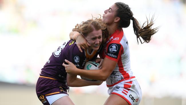 The Broncos Tamika Upton is tackled by Jessica Sergis of the Dragons in the NRLW grand final at ANZ Stadium on Sunday: Picture: AAP Image/Dan Himbrechts