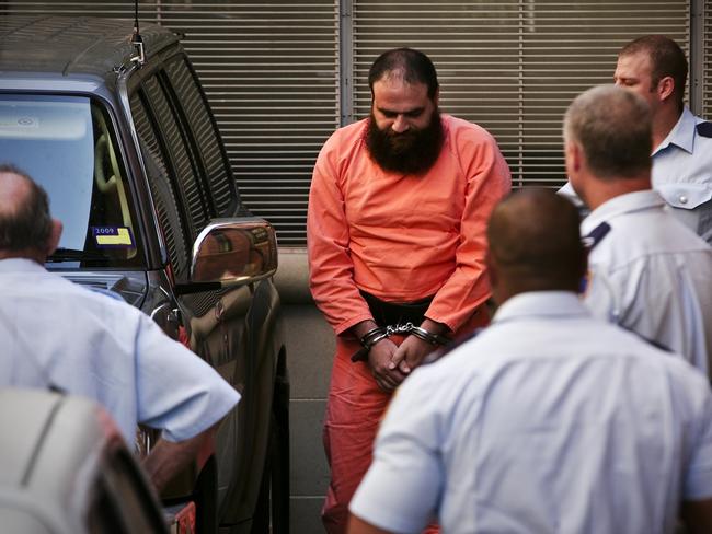 Bilal Khazal arrives in handcuffs at the NSW Supreme Court for his sentencing hearing.