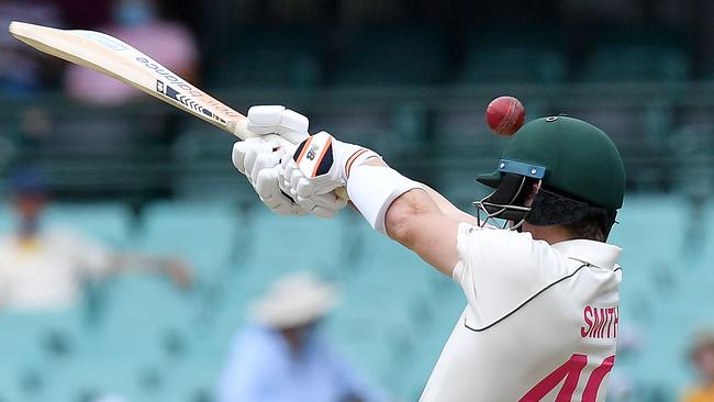 Steve Smith misses a hook shot in the first over on day two. Picture: AFP