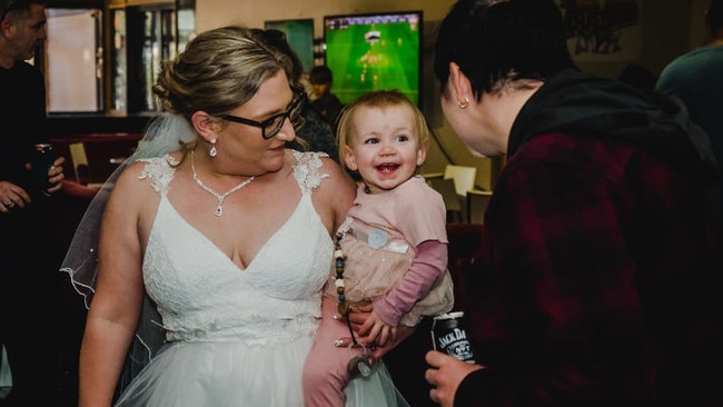 Bride Lavinia Gaff with daughter Scarlett, who is beaming at Stephy Ryan. Picture: Supplied