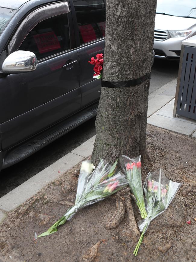 Some of the initial flowers left at the scene. Picture: David Crosling