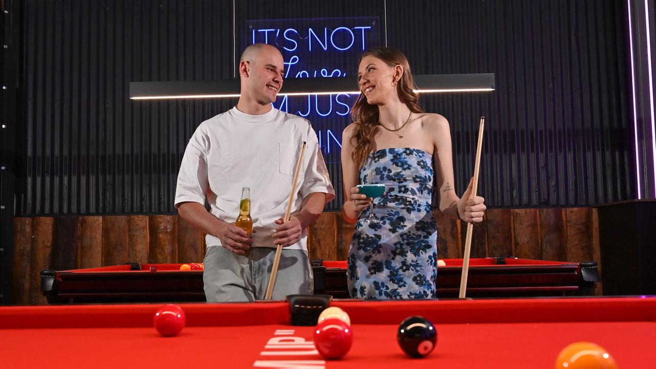 Finesse models Rudi and Chloe test out the pool table at Level Up. Picture: Keryn Stevens