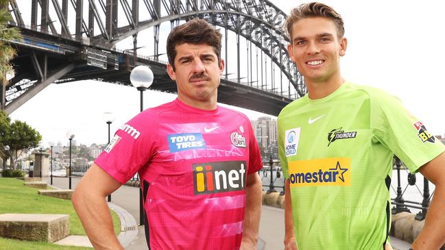 SYDNEY, AUSTRALIA - NOVEMBER 29:   Moises Henriques of the Sydney Sixers and Chris Green of the Sydney Thunder pose during the 2021/22 BBL Season Launch at Hickson Road Reserve on November 29, 2021 in Sydney, Australia. (Photo by Mark Kolbe/Getty Images)