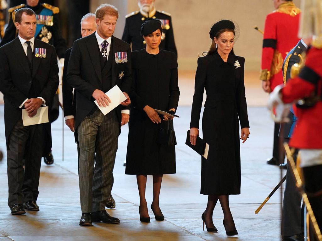 Peter Phillips, Prince Harry, Meghan, Duchess of Sussex and Catherine, Princess of Wales attend a service for the Queen. Picture: AFP.