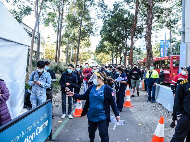 People queue to receive their vaccination at Homebush in Sydney. Picture: NCA NewsWire / Flavio Brancaleone