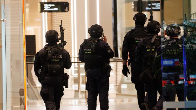 Police remained on the scene at Bondi Junction through Saturday night. Picture: Max Mason-Hubers