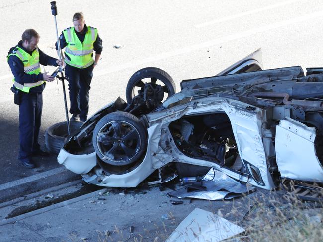 Police at the scene on the Monash fwy closed after a Ute has crashed after allegedly racing with another car that did not stop. Tuesday, December 29, 2020. Picture: David Crosling