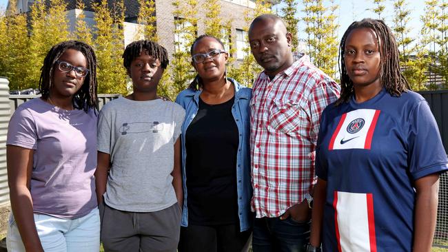 Chris and Emmah Makuthi with their kids Ethan, 12, Kendi, 15, and Tana, 14, at their home in Glenmore Park. The Makuthi family want to buy a block to build their first home. Picture: Damian Shaw