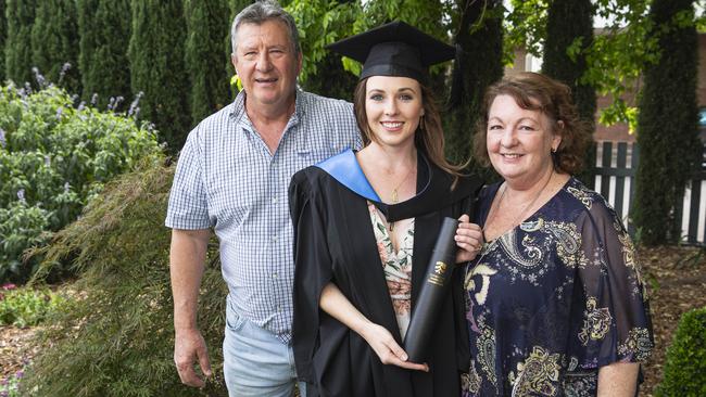 Bachelor of Nursing graduate Grace Banhidi with parents George and Melanie Banhidi at a UniSQ graduation ceremony at The Empire, Tuesday, October 29, 2024. Picture: Kevin Farmer