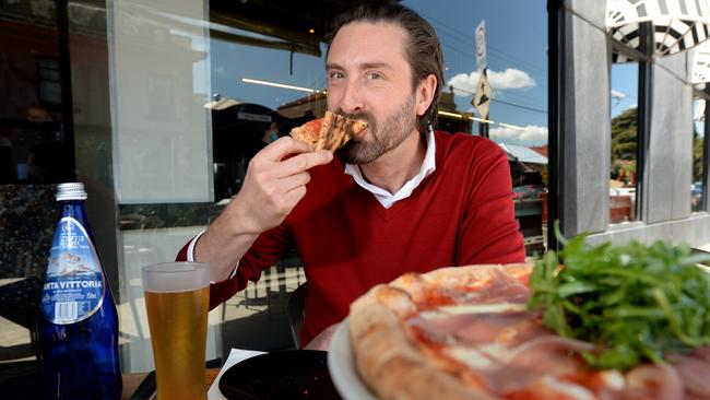 The Herald Sun's Dan Stock digs into his favourite pizza at 400 Gradi after a long break. Picture: Andrew Henshaw