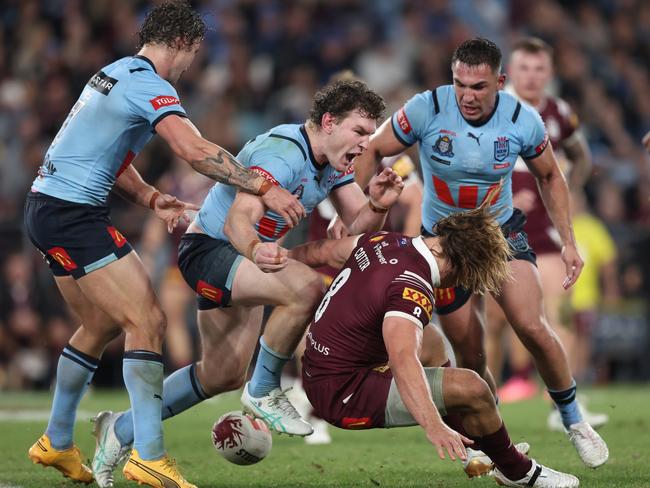 SYDNEY, AUSTRALIA - JUNE 05: Liam Martin of the Blues reacts after tackling Reuben Cotter of the Maroons during game one of the 2024 Men's State of Origin Series between New South Wales Blues and Queensland Maroons at Accor Stadium on June 05, 2024 in Sydney, Australia. (Photo by Matt King/Getty Images)