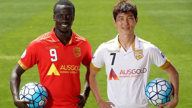 Baba Diawara and Kim Jae-sung in Adelaide’s Asian Champions League kits. Picture: Calum Robertson