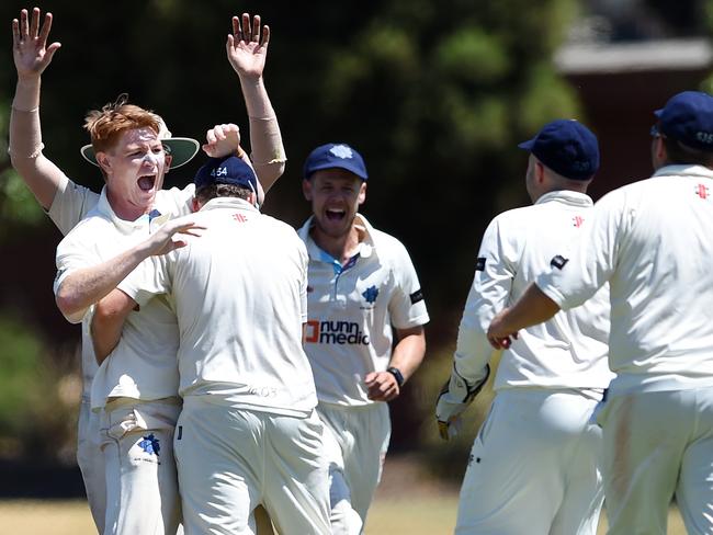 VSDCA: Kew versus Mount Waverley at Victoria Park (North Oval), Kew. Bowler W. Sist and team mates celebrate the wicket of M Sheedy.