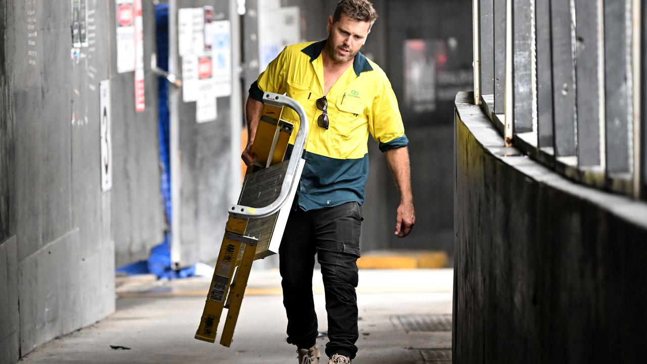 Sub-contractors and tradesmen pack up their equipment and walk off the 443 Queens Street construction site in Brisbane. Picture: Dan Peled/NCA NewsWire