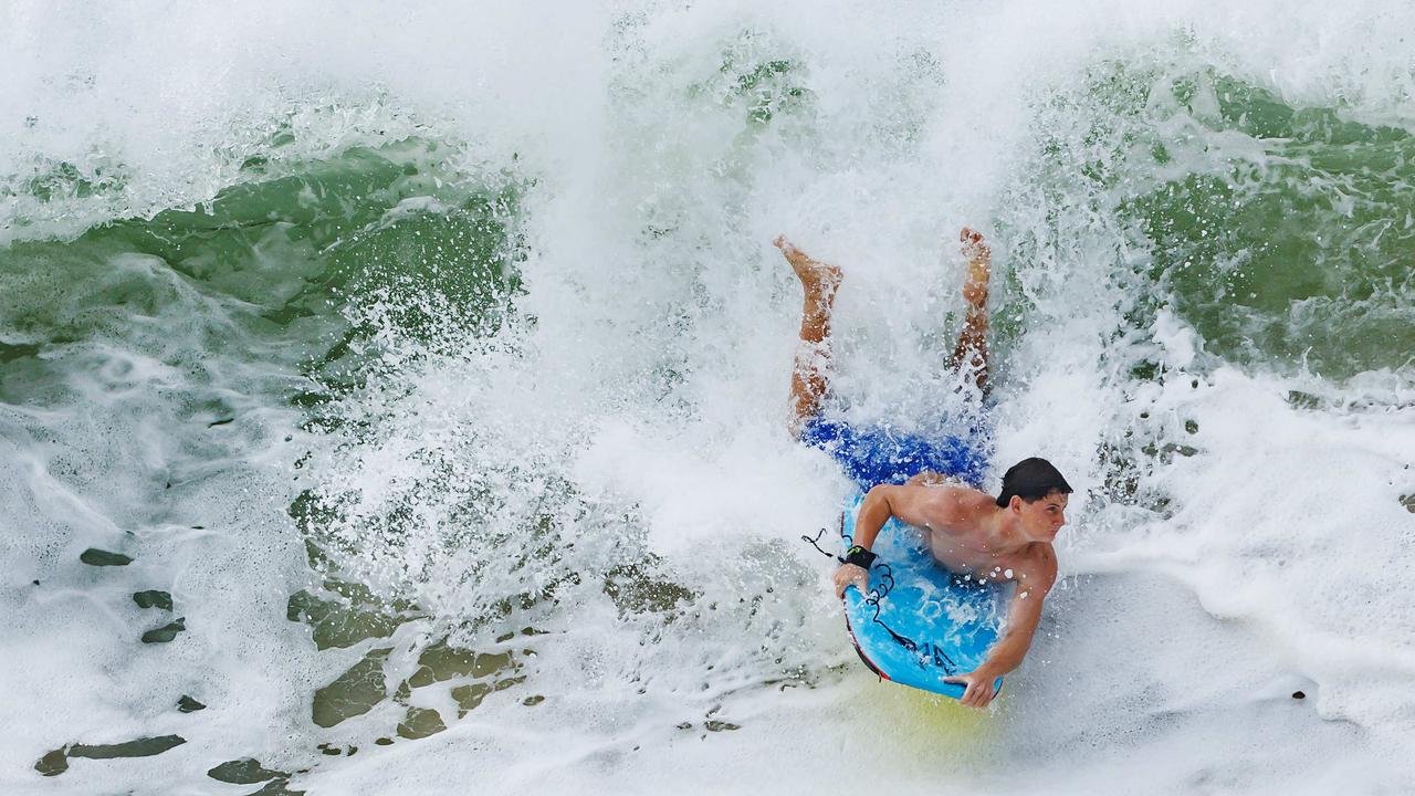 WATCH: Swimmers, surfers ‘smashed’ by cyclonic swell