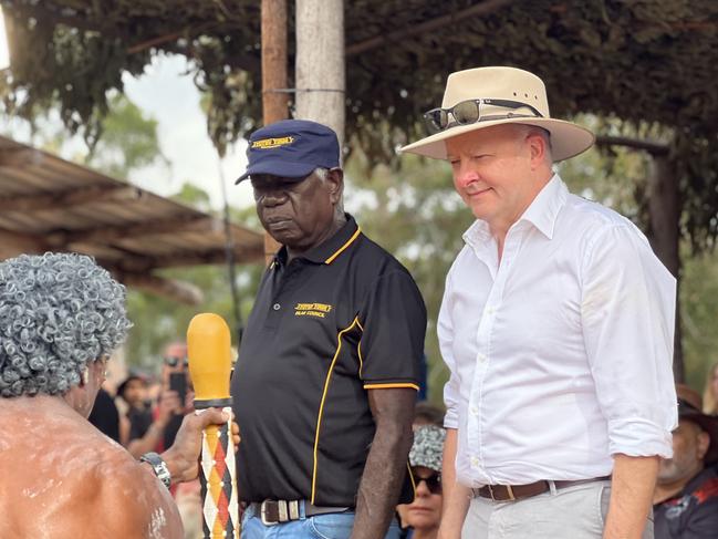 Garma Festival 2024, Gulkula, East Arnhem NT. Chairman of the Yothu Yindi Foundation Djawa Yunupingu and Prime Minister Anthony Albanese watch on as Yolngu people perform traditional dance on the Bunggul grounds for the official opening ceremony of Garma Festival. Picture: Fia Walsh.