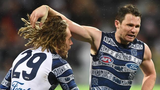 Patrick Dangerfield congratulates teammate Cam Guthrie on a goal. Picture: AAP/Julian Smith.