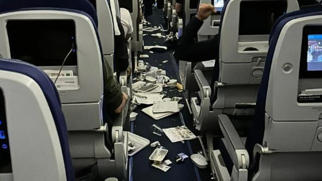 Belongings were left strewn across the aisle after the plane encountered turbulence. Picture: Twitter