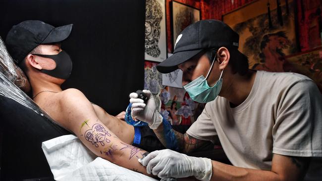 Tattoo parlours have also been given the green light to reopen. Picture: AFP