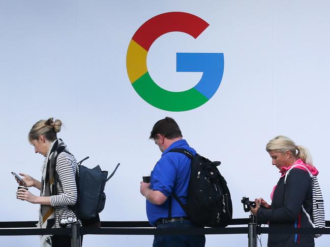 (FILES) In this file photo taken on October 4, 2017, attendees wait in line to enter a Google product launch event at the SFJAZZ Center in San Francisco, California. - Google parent Alphabet on February 2, 2021, reported that its quarterly profit rocketed some 50 percent to $15.2 billion at the end of last year as its digital ad business thrived. (Photo by Elijah Nouvelage / AFP)