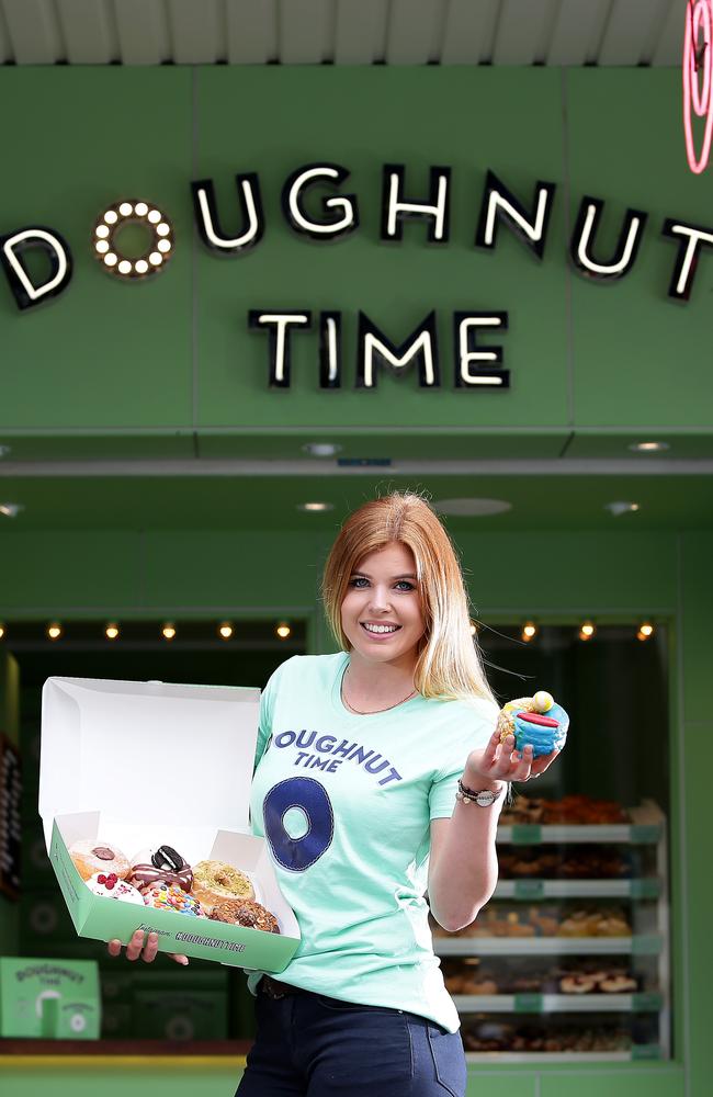 Anna van Halteren with a Manly Surf doughnut at the new Doughnut Time. Picture; Troy Snook