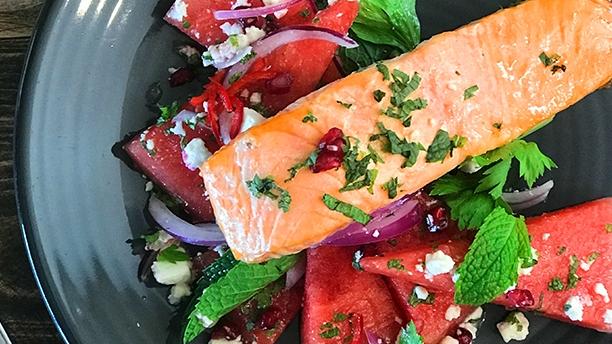 Barbecued Atlantic salmon with watermelon, pomegranate and feta salad at Woodchoppers BBQ, Smoke and Grill, Mudgeeraba.