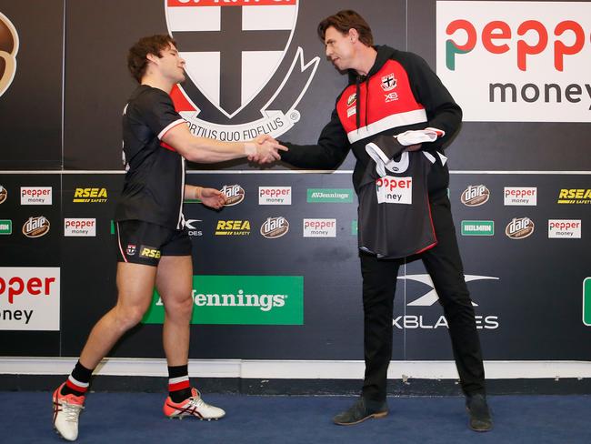 Justin Koschitzke presents Nathan Freeman with his first jumper in 2018. Picture: Darrian Traynor/Getty Images