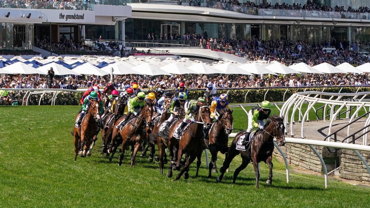 The field on the first lap of the Lexus Melbourne Cup at Flemington Racecourse on November 02, 2021 in Flemington, Australia. (Scott Barbour/Racing Photos via Getty Images)